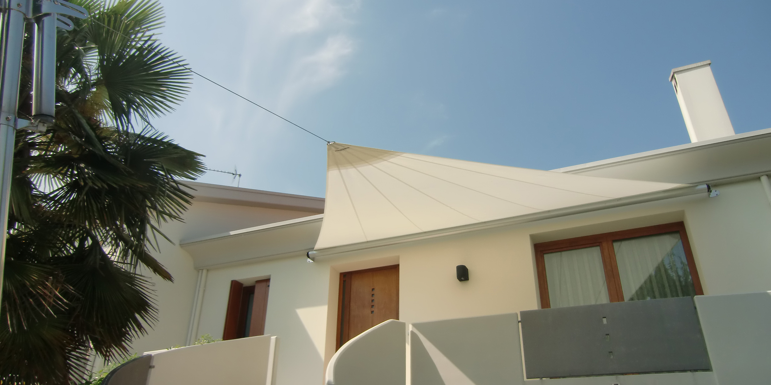 Vela ombreggiante motorizzata per giardino